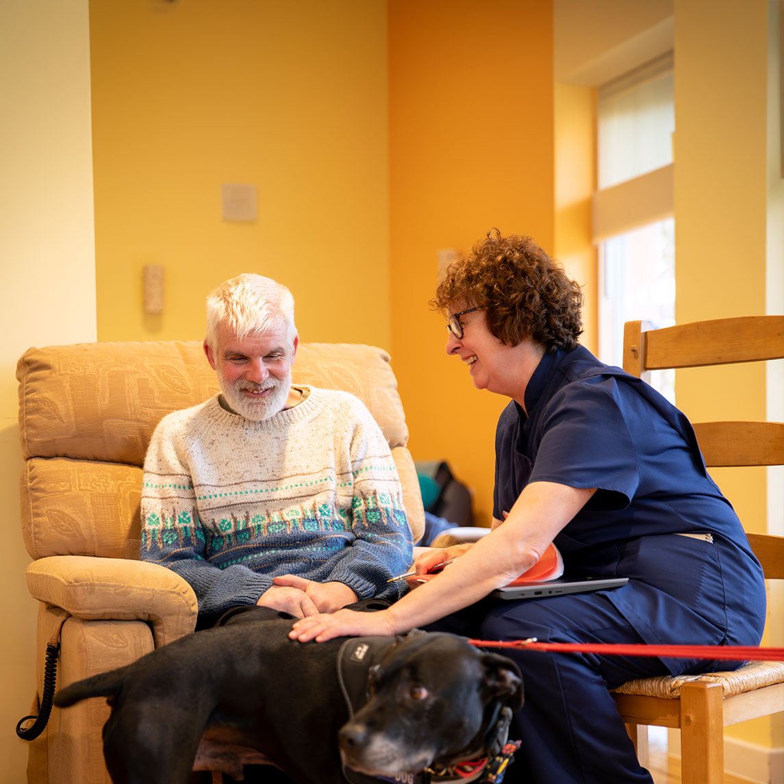 Nurse with patient and dog