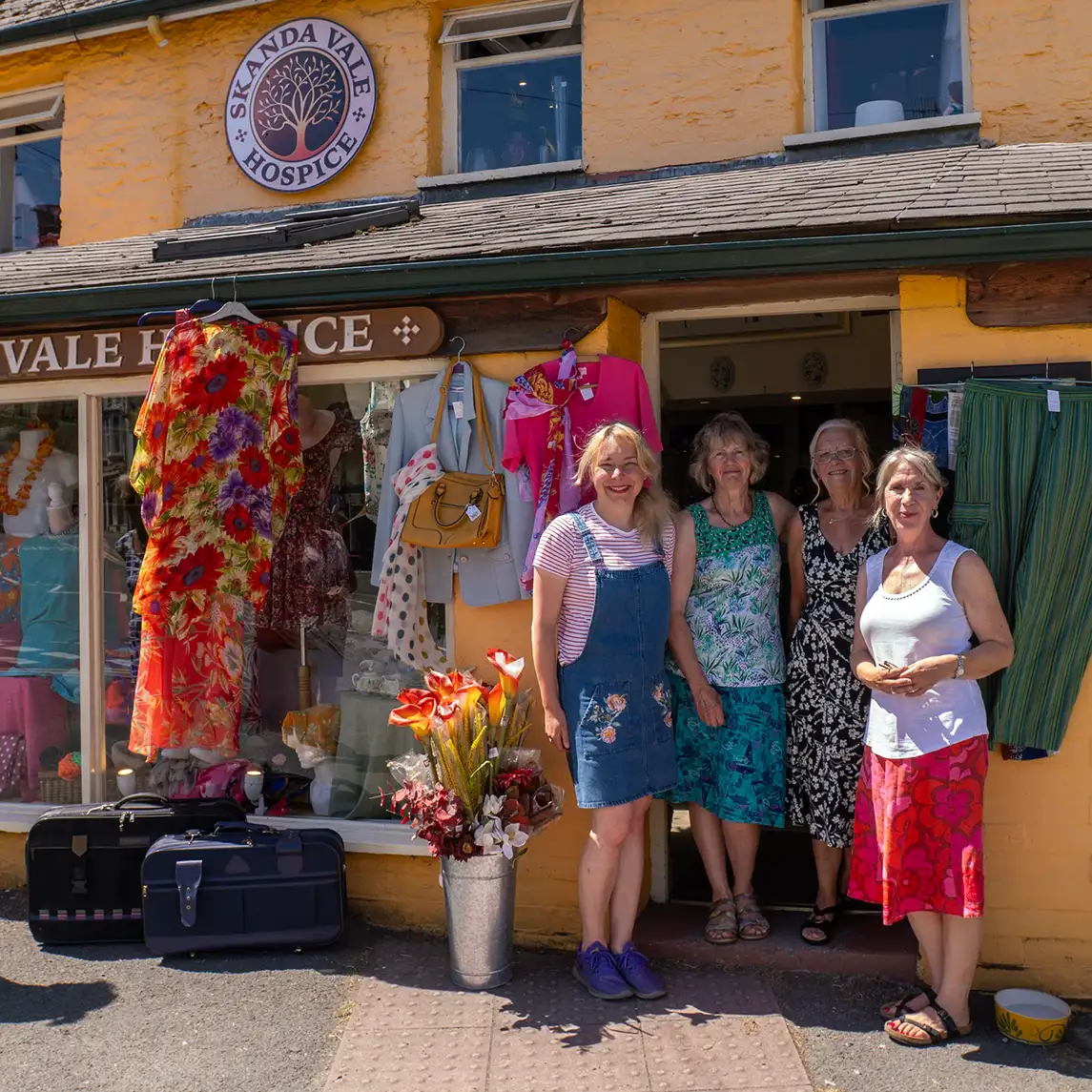 Volunteers outside the Skanda Vale Hospice charity shop in Newcastle Emlyn